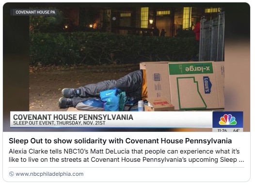 Image of a person's legs sticking out of a large cardboard box. They are outside at night in Friends Center's courtyard. A TV news caption reads, "Covenant House Pennsylvania Sleep Out Event, Thursday, November 21."